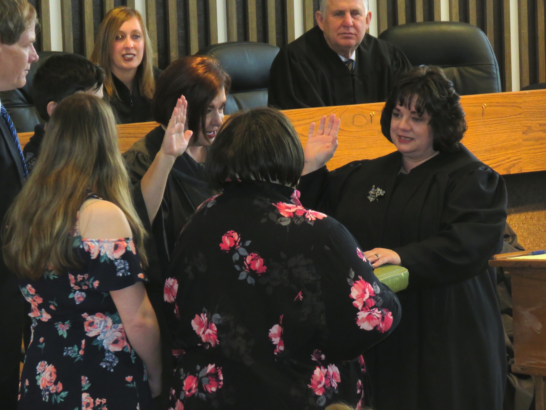 Angela Stamm-Philipps become sworn in as Wheatfield town justice by Niagara County Judge Sara Sheldon as Stamm-Philipps' mother, Audrey Stamm, holds the Bible. (Photos by David Yarger)